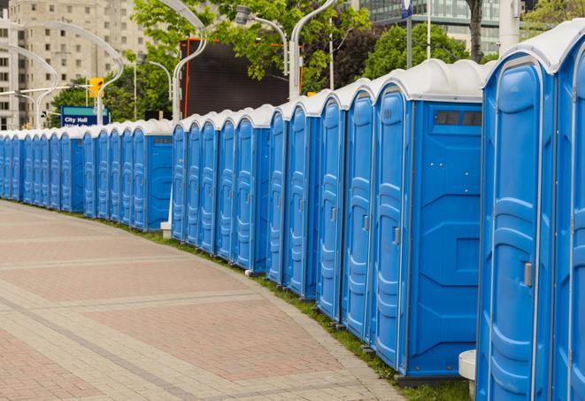 a row of portable restrooms set up for a large athletic event, allowing participants and spectators to easily take care of their needs in Berlin